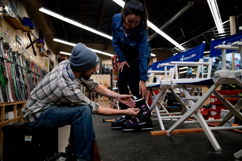 Ski boot fitting at Sun & Ski Sports for rentals 