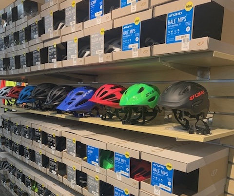 Helmet and accessories display at Sun & Ski Sports Woburn.