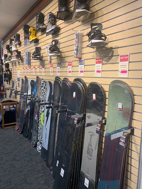 A curated mix of boards, boots, bindings, goggles, helmets, and winter apparel.