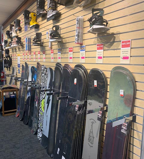 Racks of top quality snowboard at Sun & Ski Sports in Woburn