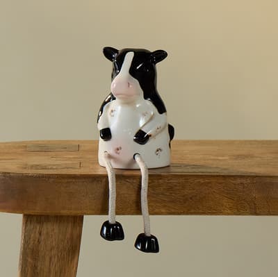 Ceramic Cow Sitter