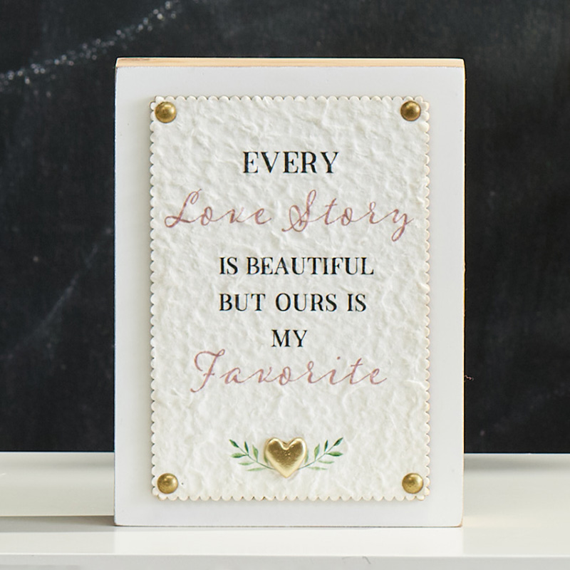 Love Story with Gold Heart Sign