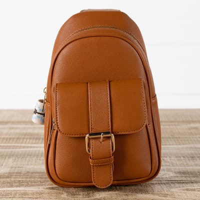 Tan Sling Backpack with Embroidered Strap
