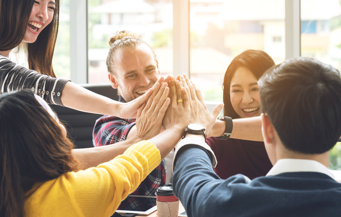 Diverse work group hifiving