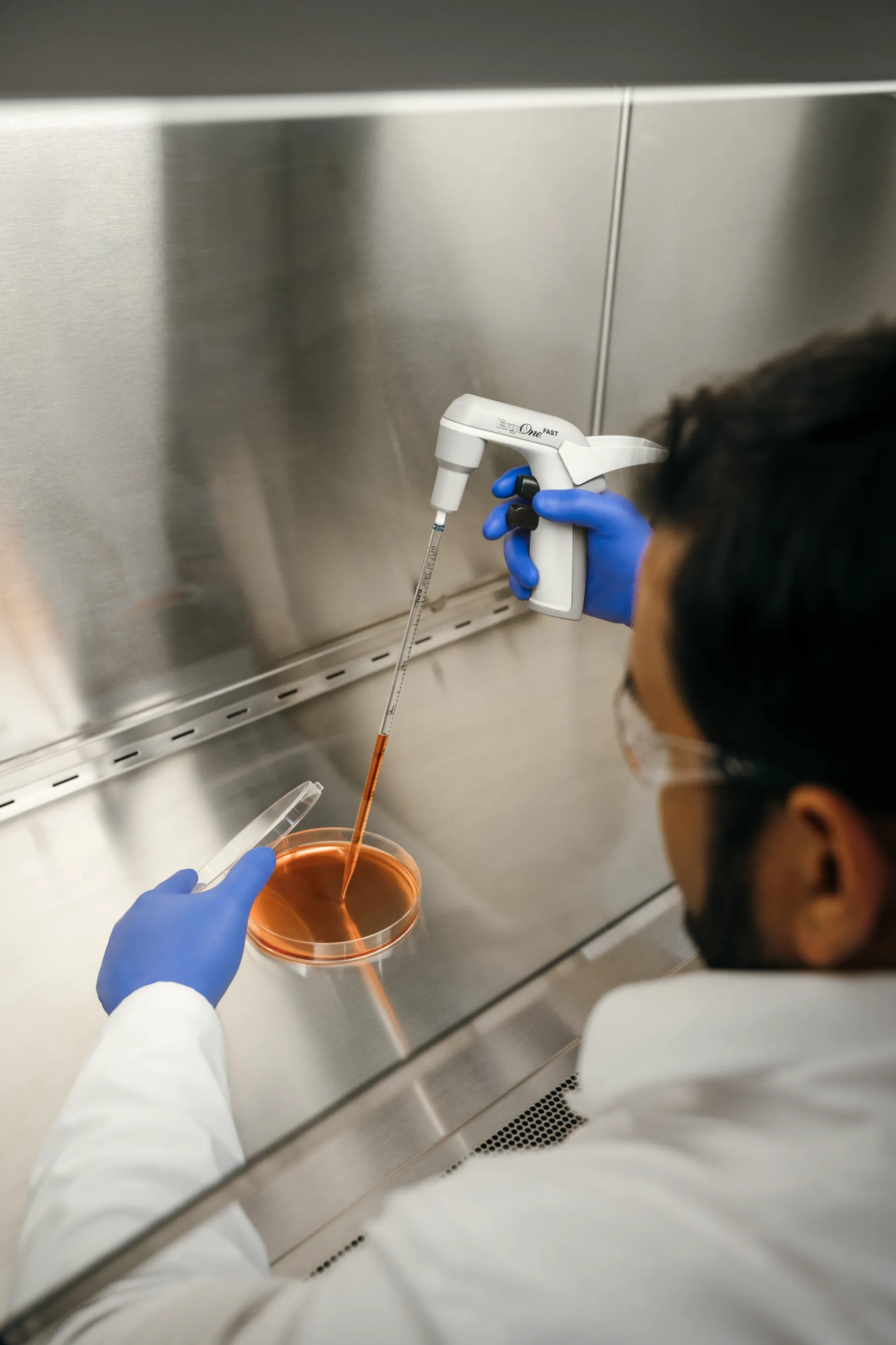 Scientist working with a serological pipette