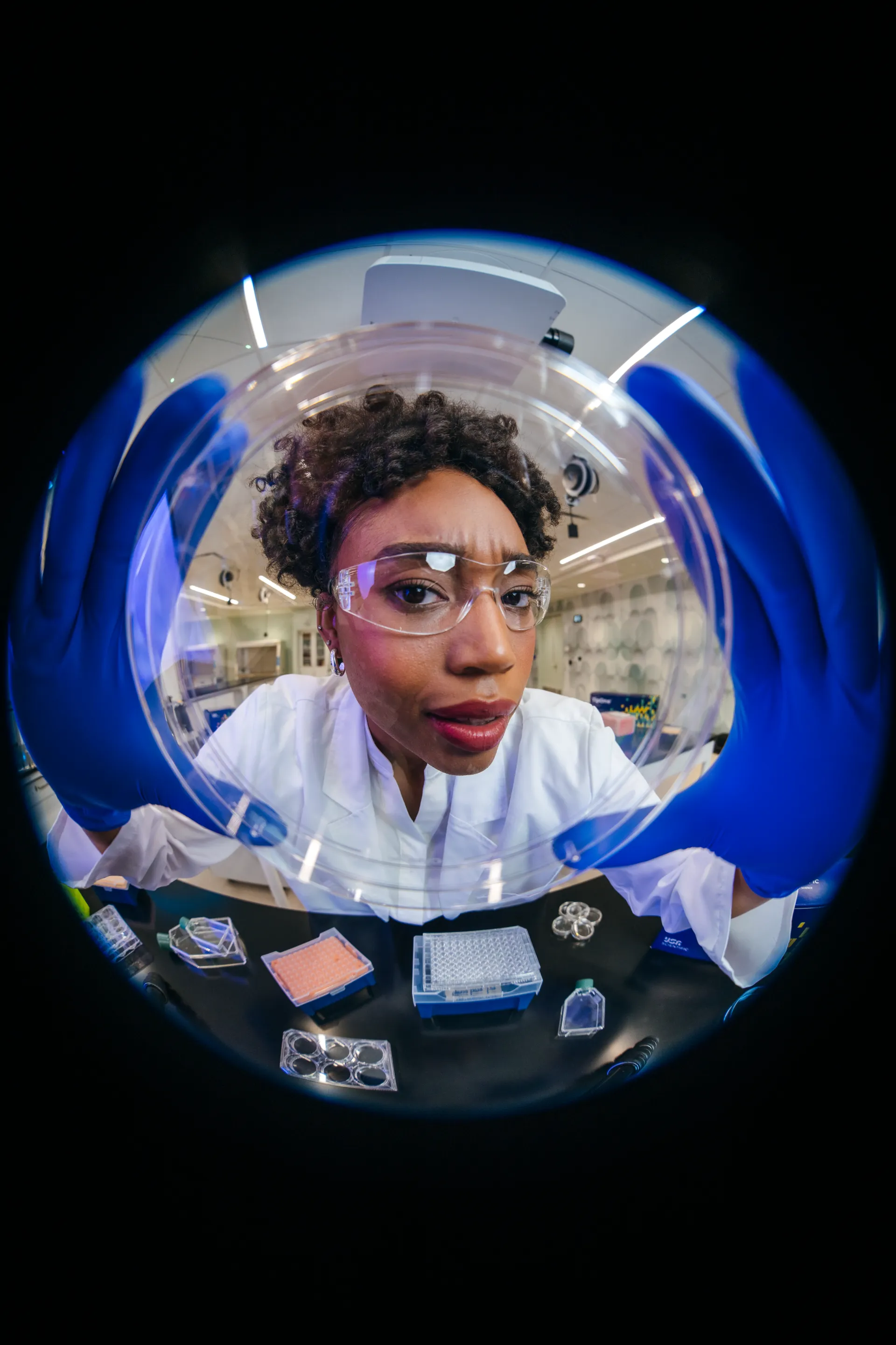Scientist examining a sample under the microscope
