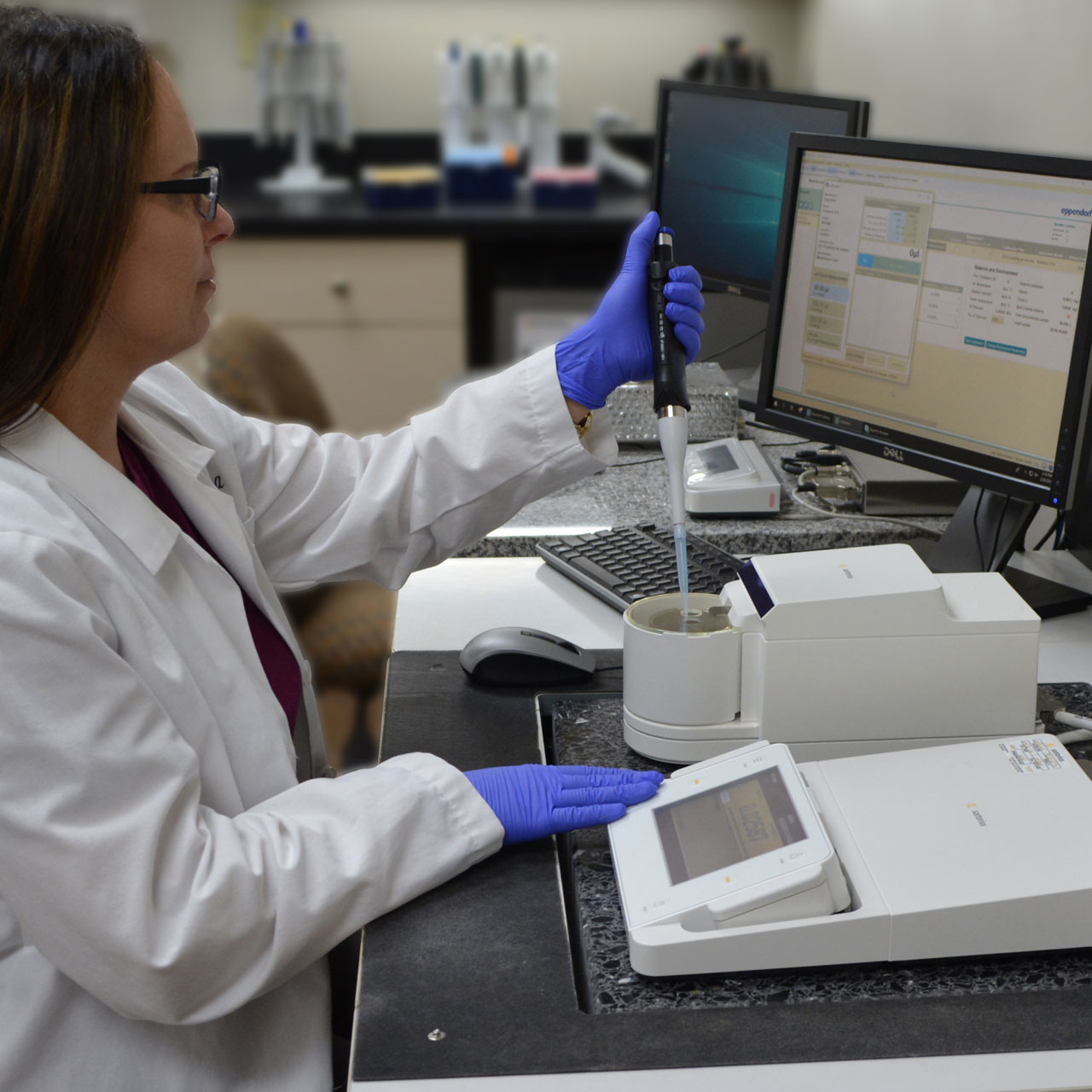 A technician precisely calibrates an ErgoOne pipet