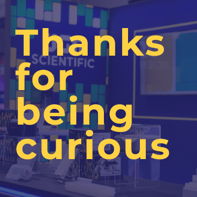 image of a trade show with the phrase, Thanks for being curious!